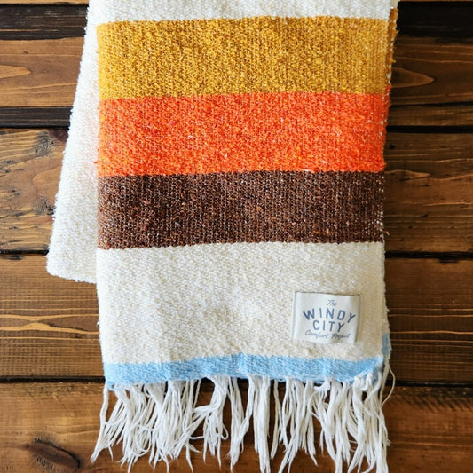 Route 66 is an extra-durable, even softer take on the traditional Falsa-style blanket! Both beautiful and sustainable, these blankets are made of reclaimed fibers derived from 100% post-consumer materials containing a special blend of cotton, acrylic, and polyester