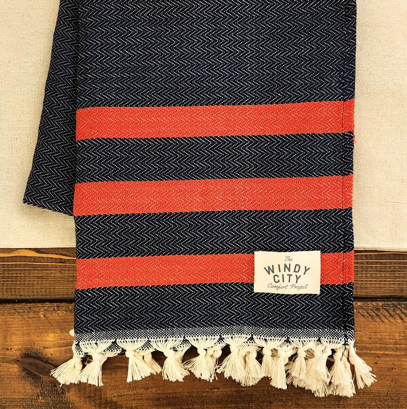 his 100% Organic Turkish Cotton, medium-weight throw blanket features two sets of stripes and a tightly woven pattern, making it versatile, super soft, and extra cozy. Perfect for the man cave, living room, or with all your tailgating essentials, this oversized 72" x 51" throw is a must-have at kickoff.