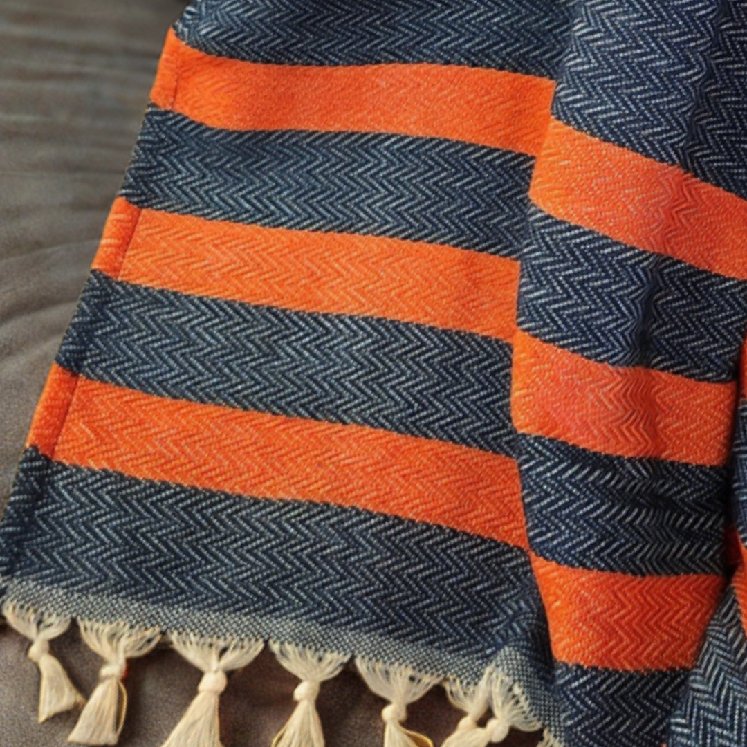 his 100% Organic Turkish Cotton, medium-weight throw blanket features two sets of stripes and a tightly woven pattern, making it versatile, super soft, and extra cozy. Perfect for the man cave, living room, or with all your tailgating essentials, this oversized 72" x 51" throw is a must-have at kickoff.