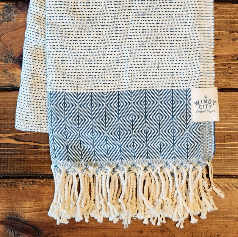 Summer Turkish Blanket - Cobalt-Our popular Turkish Blankets are back and even better this year! Now crafted by a family business in Turkey from 100% OEKO-TEX certified organic cotton, and slightly bigger at 72" x 38", this Turkish Towel is ready for all your spring and summer activities! Perfect to use as a blanket, shawl, wrap, scarf, throw, tablecloth, picnic blanket, bath towel... the options are endless! The tightly weaved cotton makes them sand-repellent and quick drying - the ideal blanket to take to